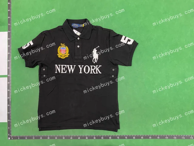 Black polo shirt — single-product front QC photo