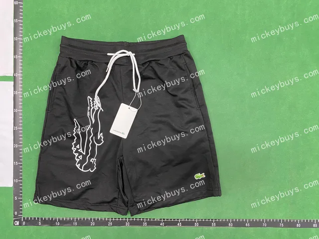 Black drawstring shorts — single-product front QC photo