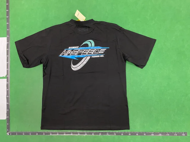 Black graphic T-shirt — single-product front QC photo